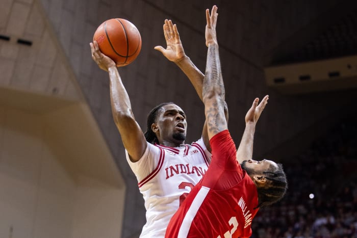 Indiana Hoosiers forward Mackenzie Mgbako (21) shoots the ball while Nebraska Cornhuskers guard Brice Williams (3) defends in the first half at Simon Skjodt Assembly Hall.